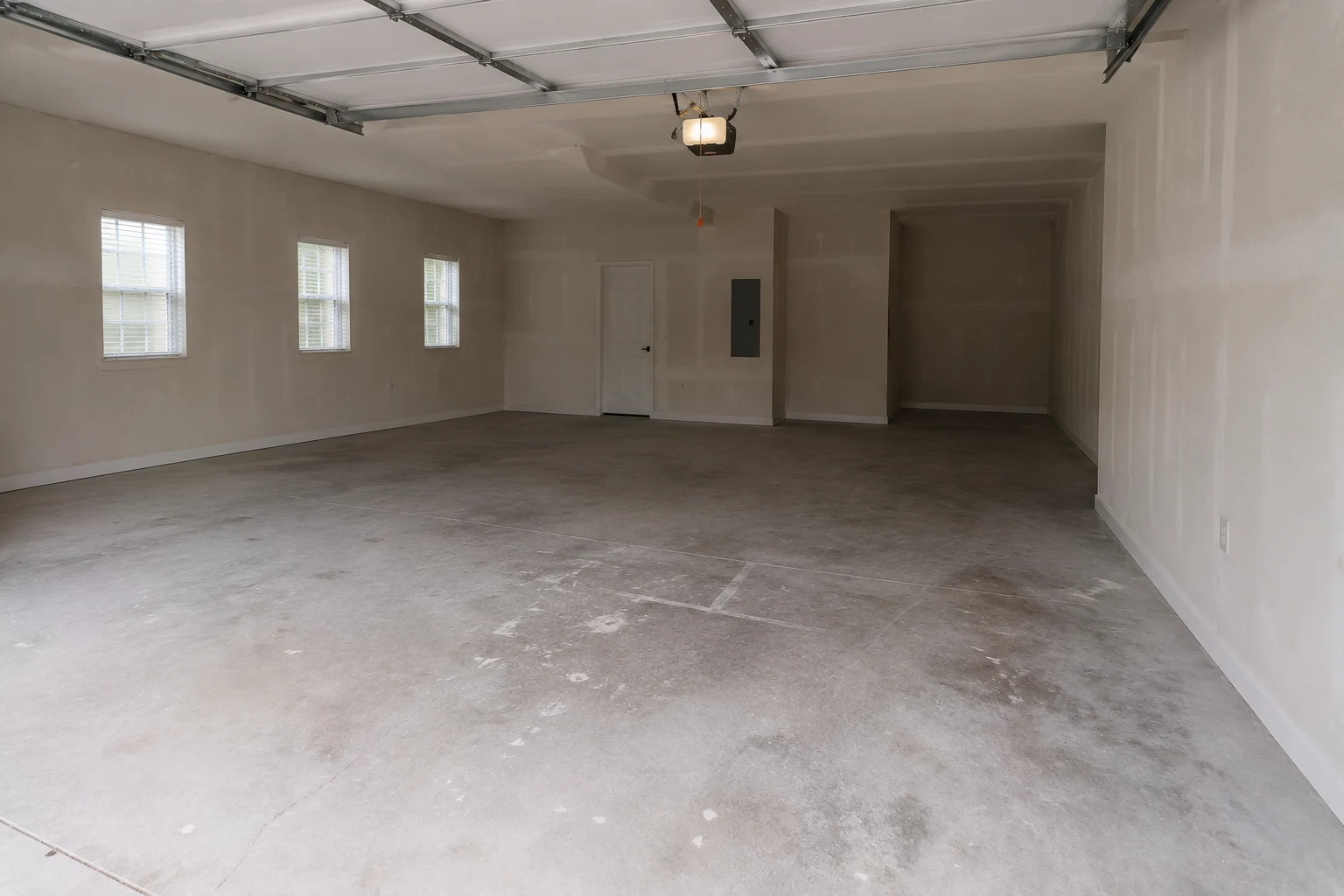 Dated, dimly lit garage before renovation